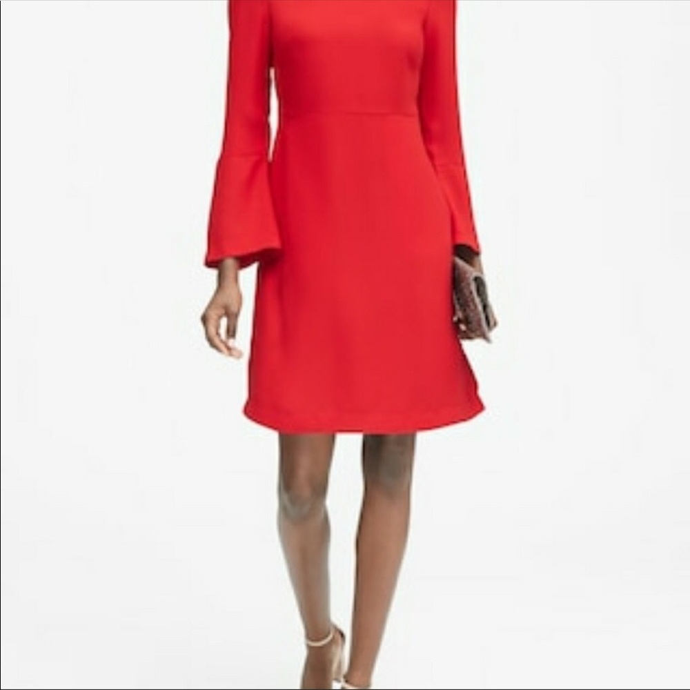Red long sleeved tie back dress